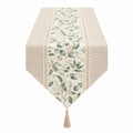 Chemin de table élégant avec feuilles vertes et bordure en dentelle
